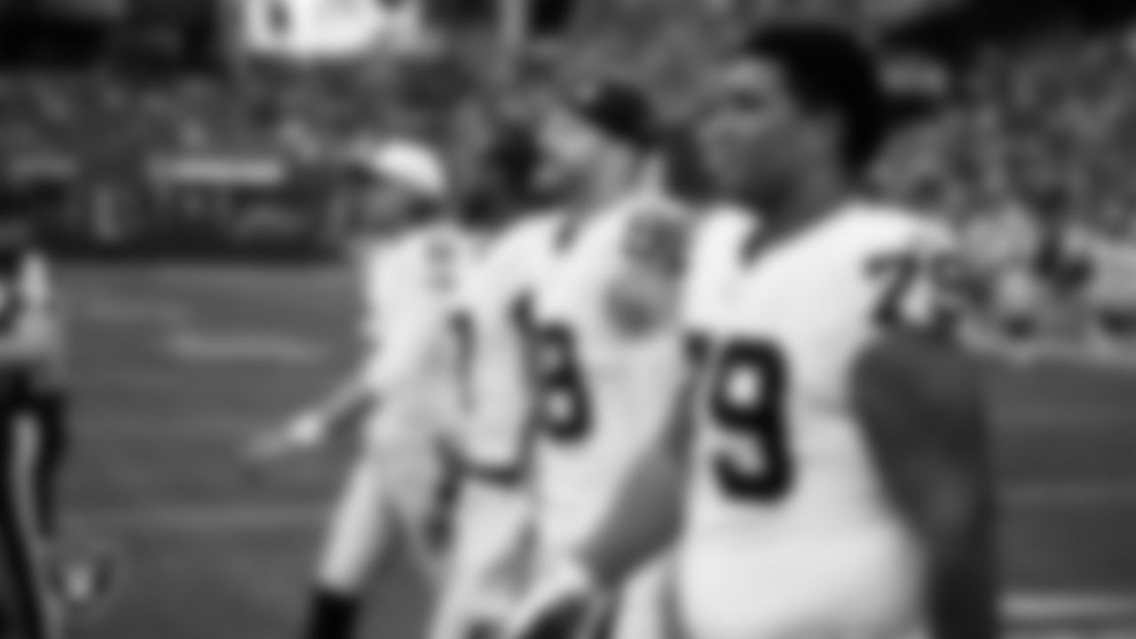Las Vegas Raiders offensive lineman Laki Tasi (79) walks out to the center of the field for the coin toss before the preseason away game against the the Seattle Seahawks at Lumen Field.
