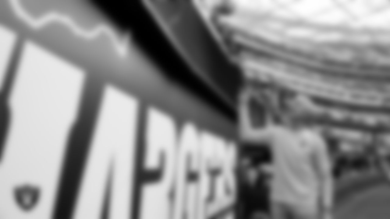 Las Vegas Raiders Head Coach Pete Carroll signs autographs for fans before the regular season away game against the Los Angeles Chargers at SoFi Stadium.