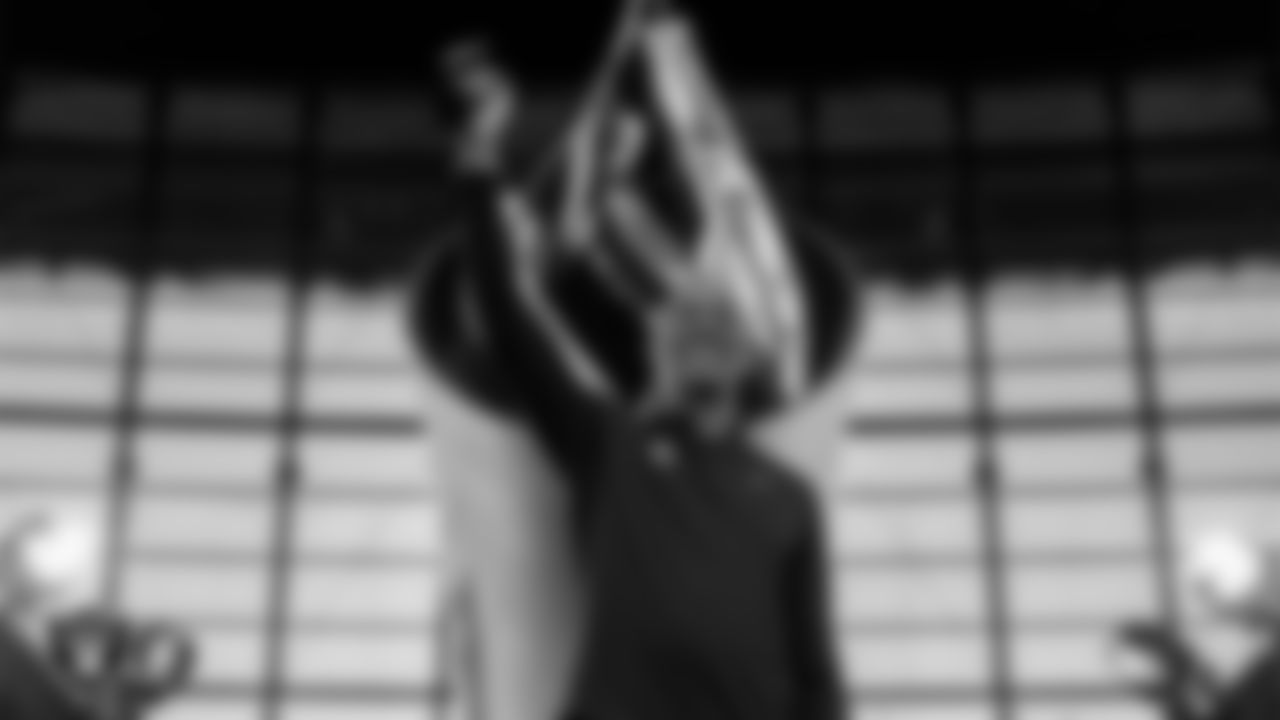 Las Vegas Raiders alumnus James Lofton lights the Al Davis Memorial Torch before the Las Vegas Raiders' regular season home game against the Cleveland Browns at Allegiant Stadium.