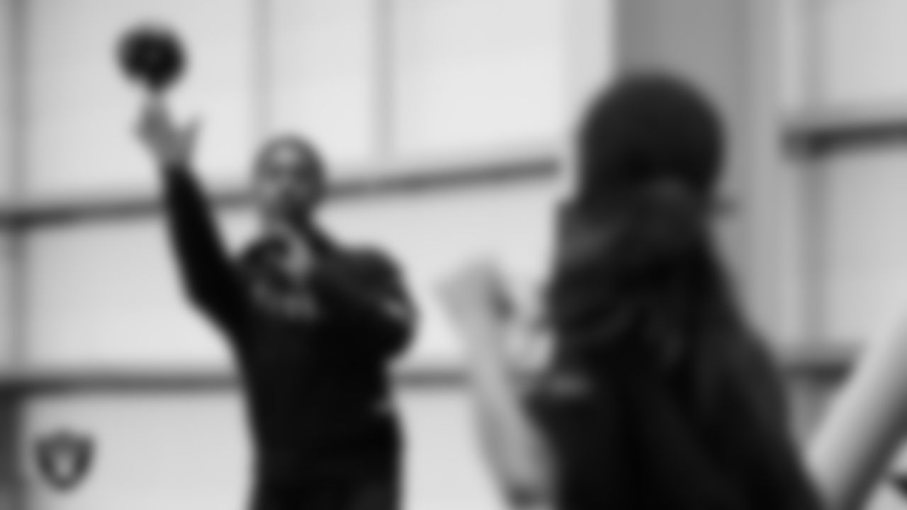 A member of the Grambling State University football team helps on a drill during a Raiders Junior Training Camp at Intermountain Health Performance Center.