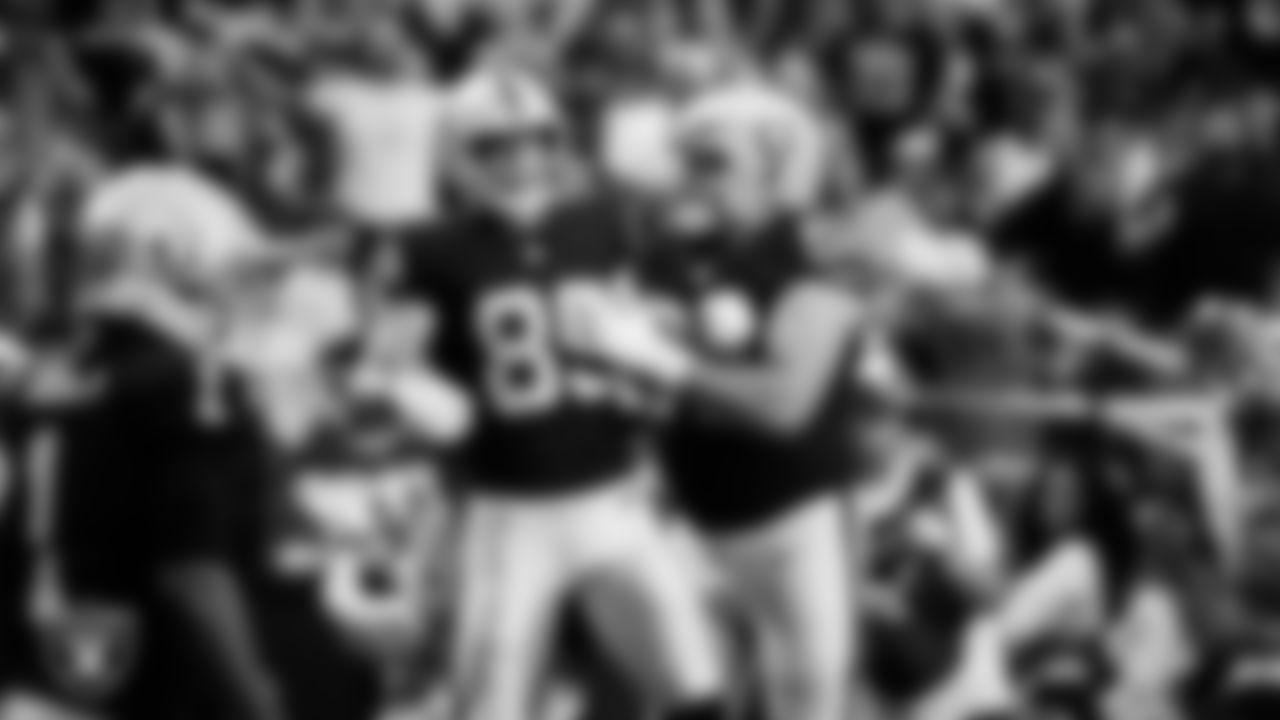 Las Vegas Raiders tight end Brock Bowers (89) celebrates with guard/center Jackson Powers-Johnson (58) after making a 7-yard touchdown catch during the regular season home game against the Jacksonville Jaguars at Allegiant Stadium.