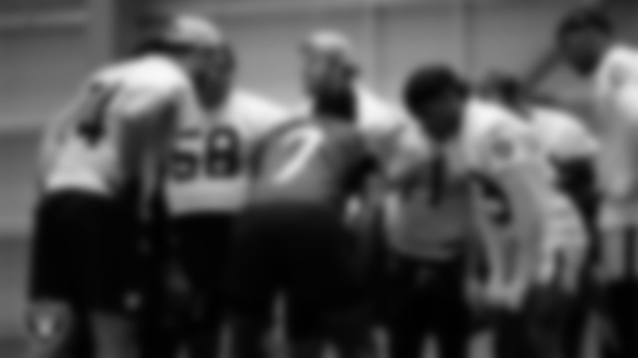 The Las Vegas Raiders huddle at a workout during phase two of the offseason program at Intermountain Health Performance Center.