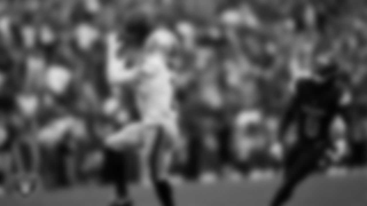 Las Vegas Raiders wide receiver Tre Tucker (1) goes for a 61-yard touchdown catch during the regular season away game against the Washington Commanders at Northwest Stadium.