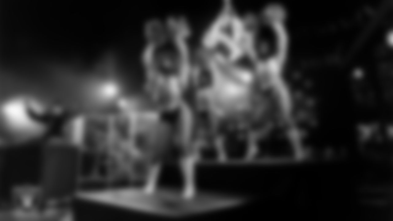 Raiderettes Pip, Tatiana and Bria perform with Rapper Nelly at halftime during the regular season home game against the Dallas Cowboys at Allegiant Stadium.