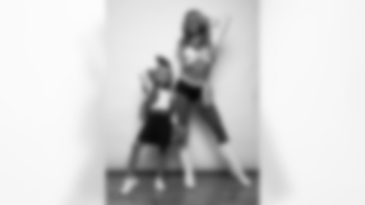Raiderette Hayley poses for a photo with a Junior Raiderette during 2025 Media Day at The Studio.