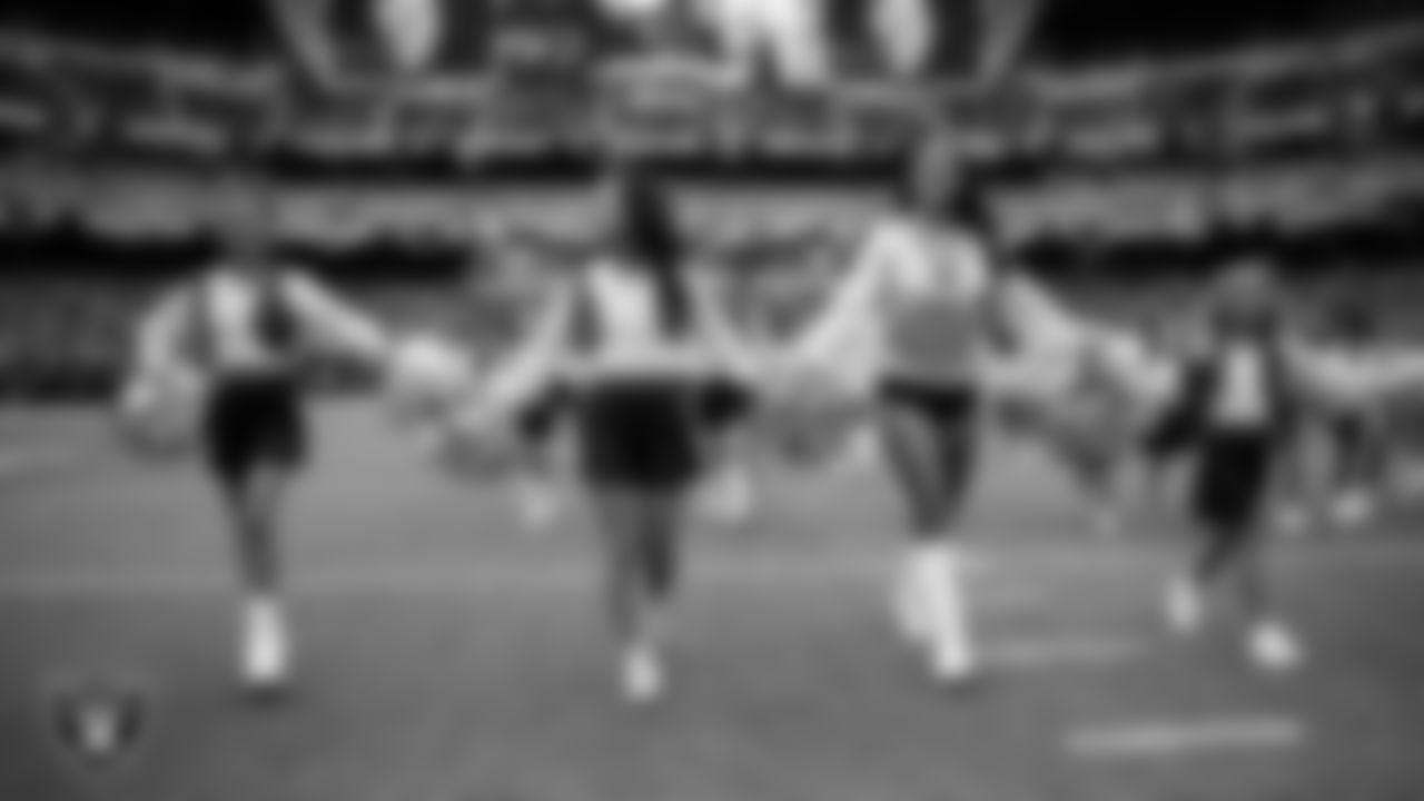 Raiderette Reagan and Junior Raiderettes exit the field after their performance before the preseason home game against the San Francisco 49ers at Allegiant Stadium.