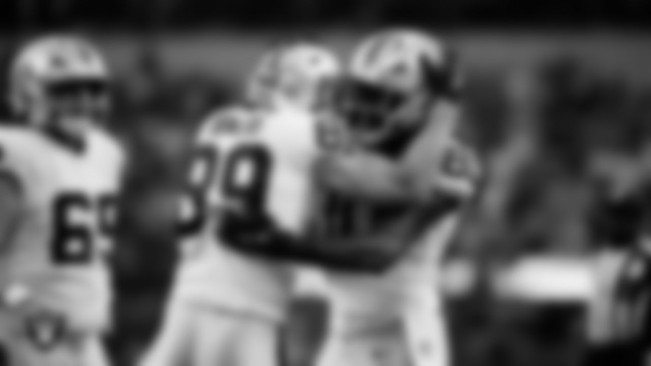 Las Vegas Raiders tight end Brock Bowers (89) celebrates with tight end Ian Thomas (80) after making a 6-yard touchdown catch during the regular season away game against the Los Angeles Chargers at SoFi Stadium.