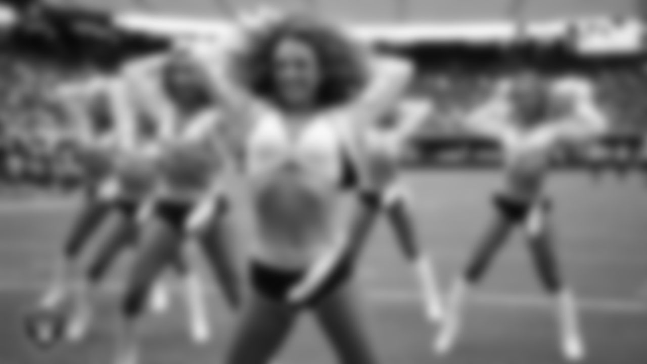 Raiderette Lexie performs on the field during a 2025 Training Camp mock game at Allegiant Stadium.