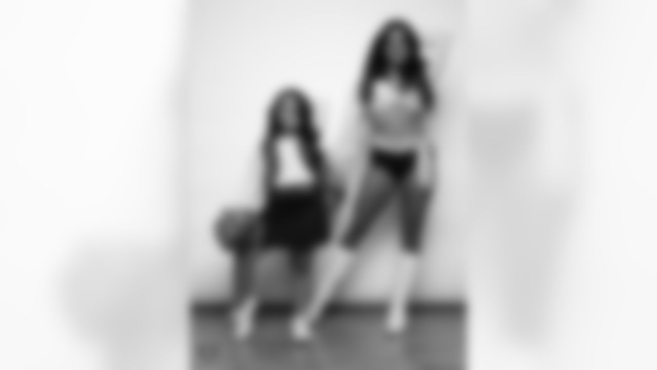 Raiderette Annalise poses for a photo with a Junior Raiderette during 2025 Media Day at The Studio.