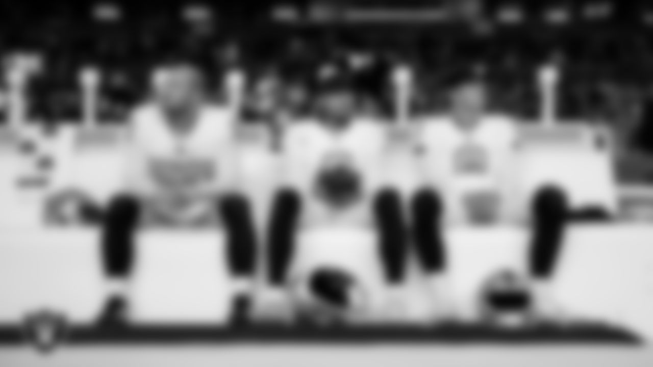 Las Vegas Raiders long snapper Jacob Bobenmoyer (50), punter AJ Cole (6) and kicker Daniel Carlson (8) on the bench before the regular season away game against the Denver Broncos at Empower Field at Mile High.