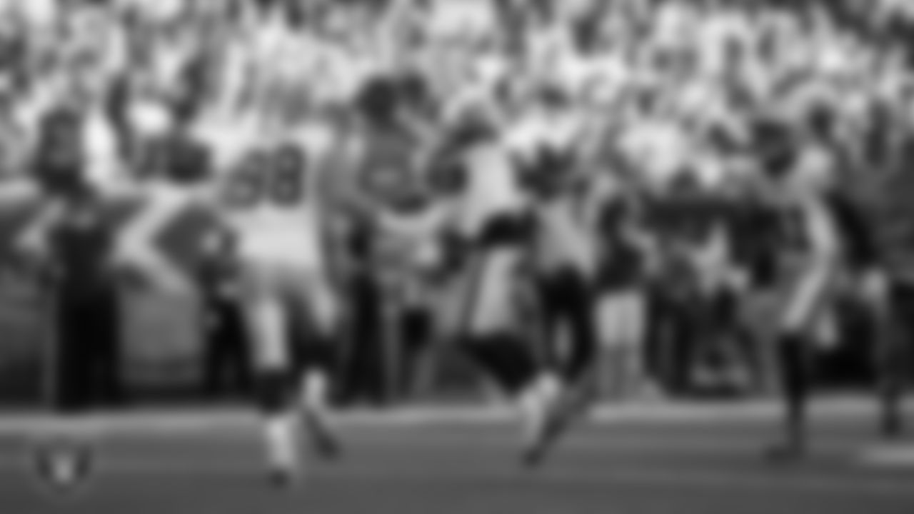 Las Vegas Raiders linebacker Devin White (45) celebrates with defensive end Maxx Crosby (98) after making a tackle during the regular season away game against the Houston Texans at NRG Stadium.