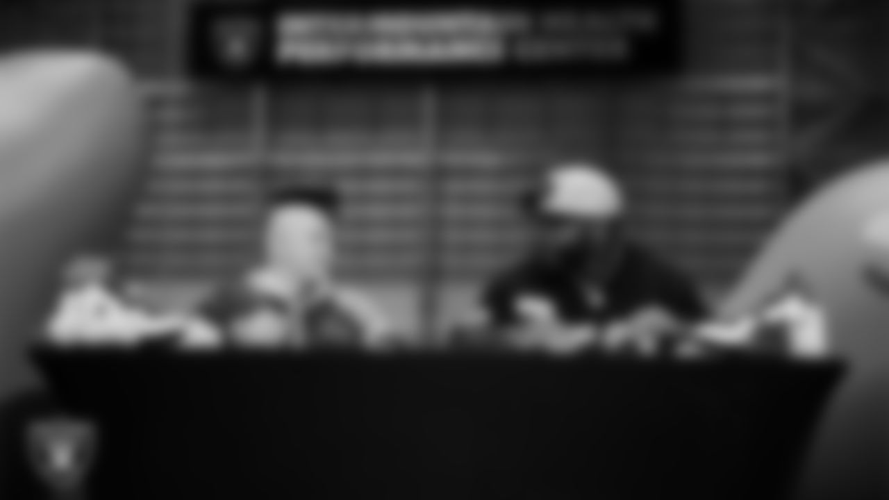 Las Vegas Raiders linebacker Elandon Roberts (52) designs cleats for My Cause My Cleats with Intermountain Children's Health patient Isaak at Intermountain Health Performance Center.