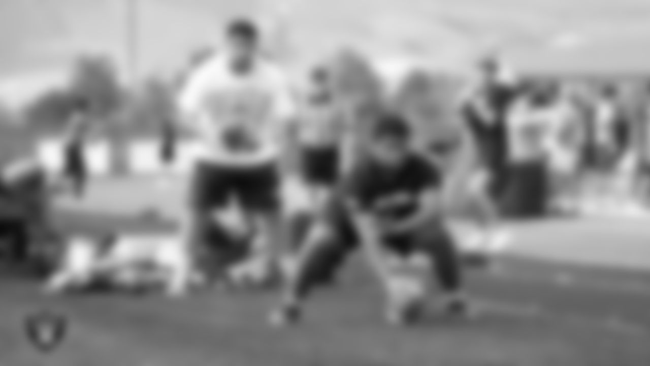 Athletes warm up during a Las Vegas Raiders 11-ON event at Damonte Ranch High School.