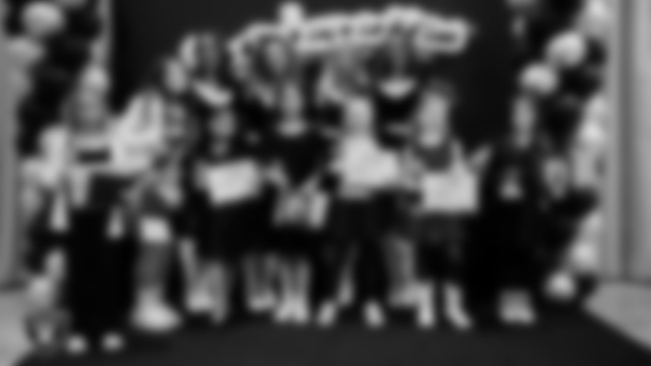 Raiderettes pose for a photo with Junior Raiderettes during the Junior Raiderettes Banquet at The Studio.