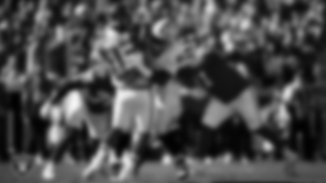 Las Vegas Raiders defensive tackle Jonah Laulu (96) pressures the quarterback during the regular season away game against the Kansas City Chiefs at GEHA Field at Arrowhead Stadium.