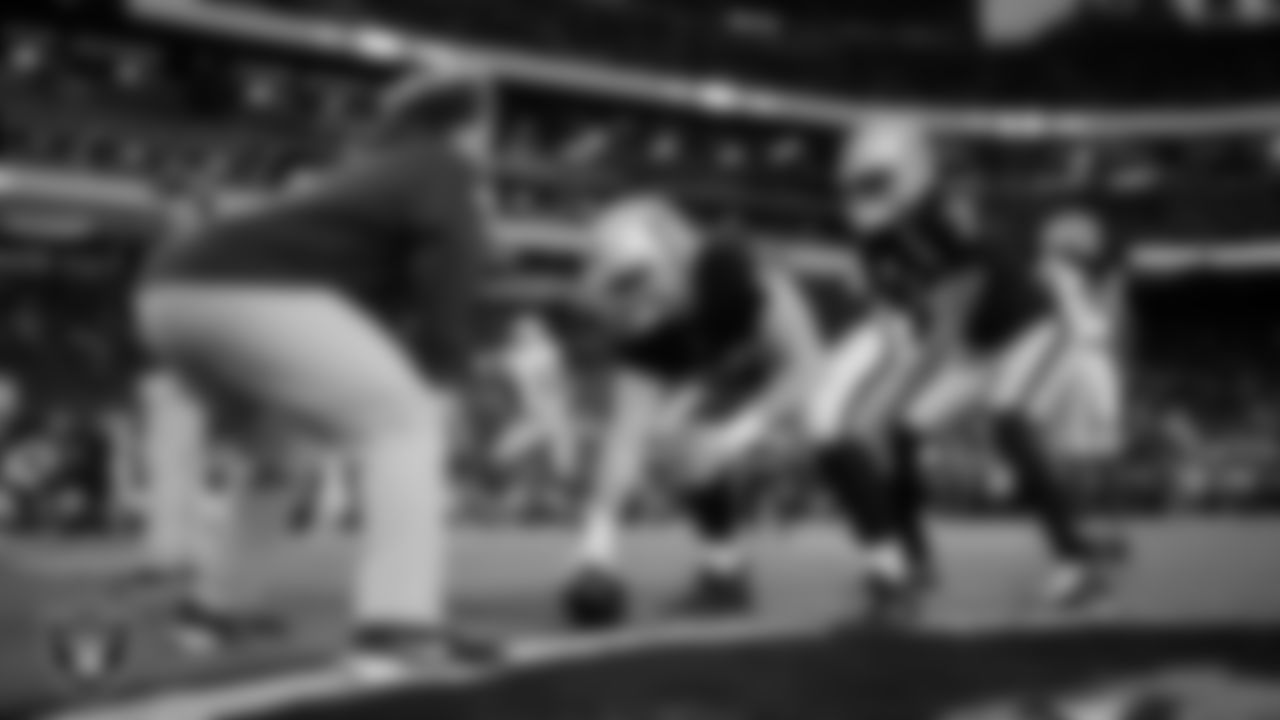Las Vegas Raiders center Will Putnam (67) and quarterback Geno Smith (7) warming up before the regular season home game against the Dallas Cowboys at Allegiant Stadium.