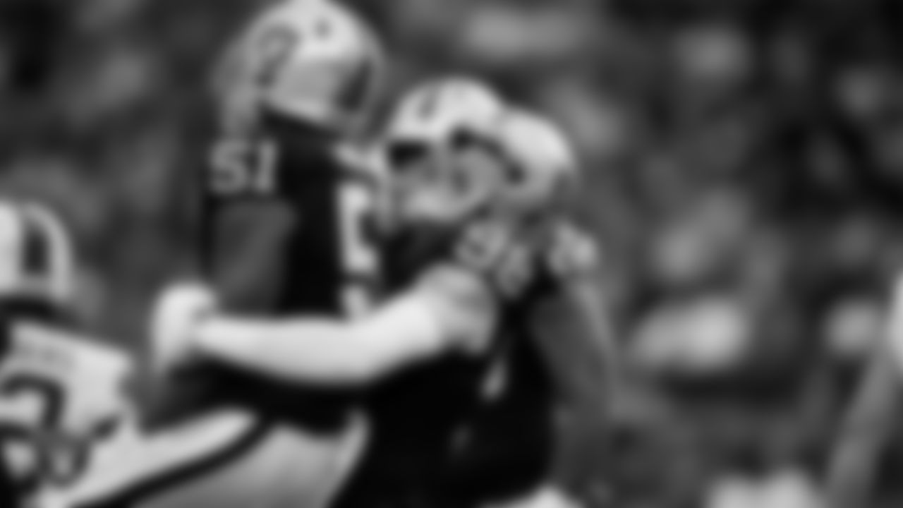 Las Vegas Raiders defensive end Malcolm Koonce (51) celebrates with defensive end Maxx Crosby (98) after sacking the quarterback during the regular season home game against the Cleveland Browns at Allegiant Stadium.