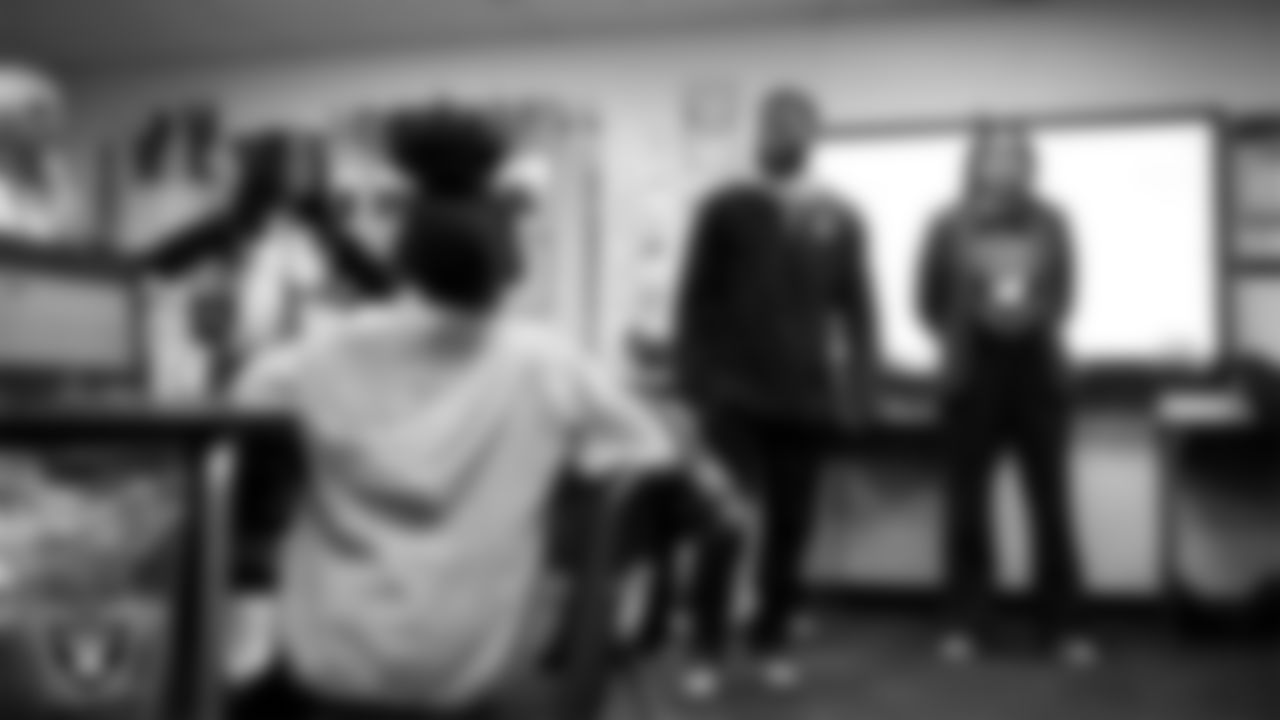 Las Vegas Raiders coordinator of football development Chris Shelby speaks to students during a 'Lil Raiders Pop-Up at Matt Kelly Elementary School.