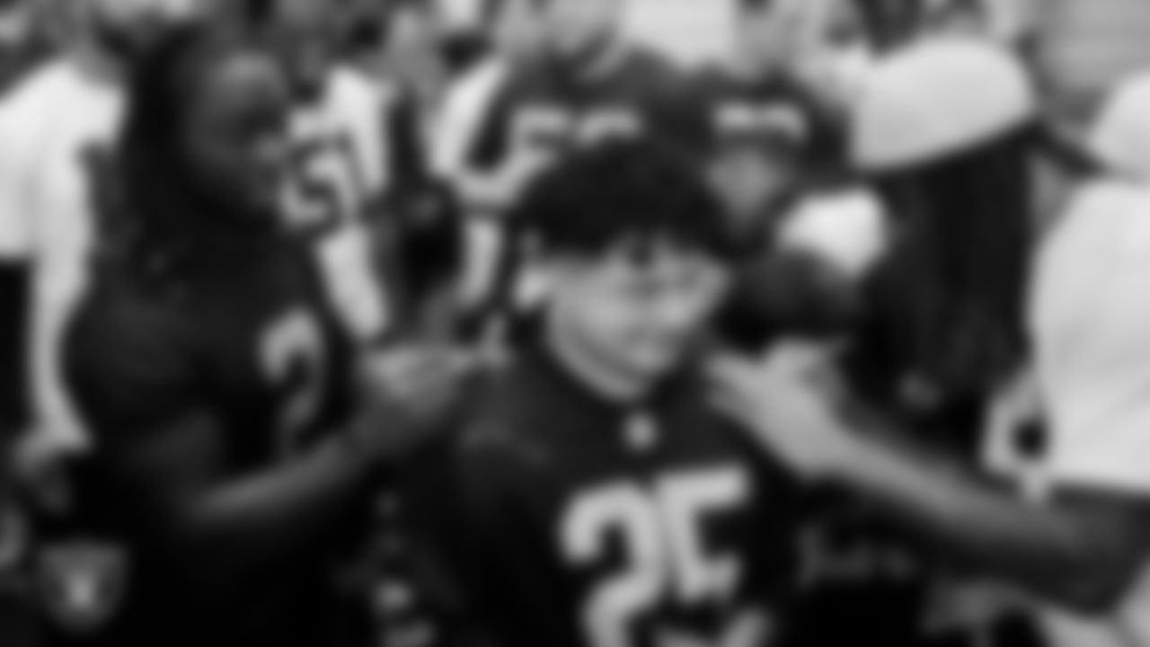 Marcos Carrillo from Make-A-Wish gets his jersey signed after practice during a visit to Intermountain Health Performance Center.