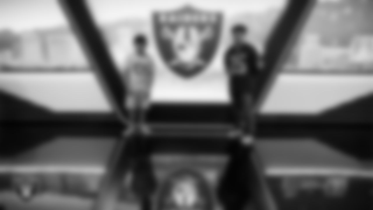 Christopher Arias and Marcos Carrillo from Make-A-Wish pose for a photo in the Cox Studio during a visit to Intermountain Health Performance Center.