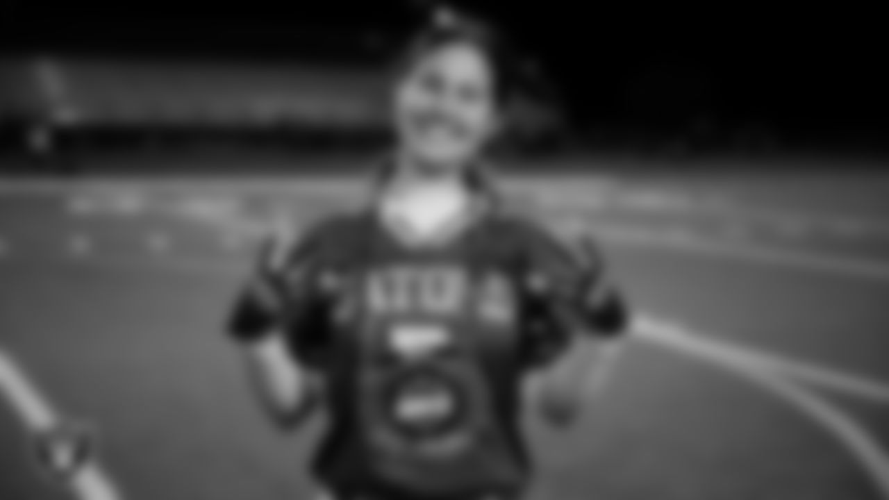 Green Valley High School wide receiver and safety Lyla Baxter (2) poses for a photo with the MVP chain after the Las Vegas Raiders' High School Flag Football Showcase game at Green Valley High School.