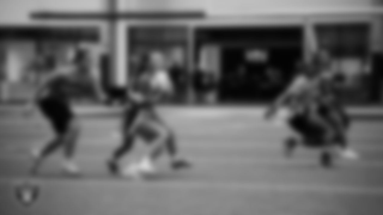 Athletes compete in the Silver and Black Championship game during Play Football Day at Intermountain Health Performance Center.