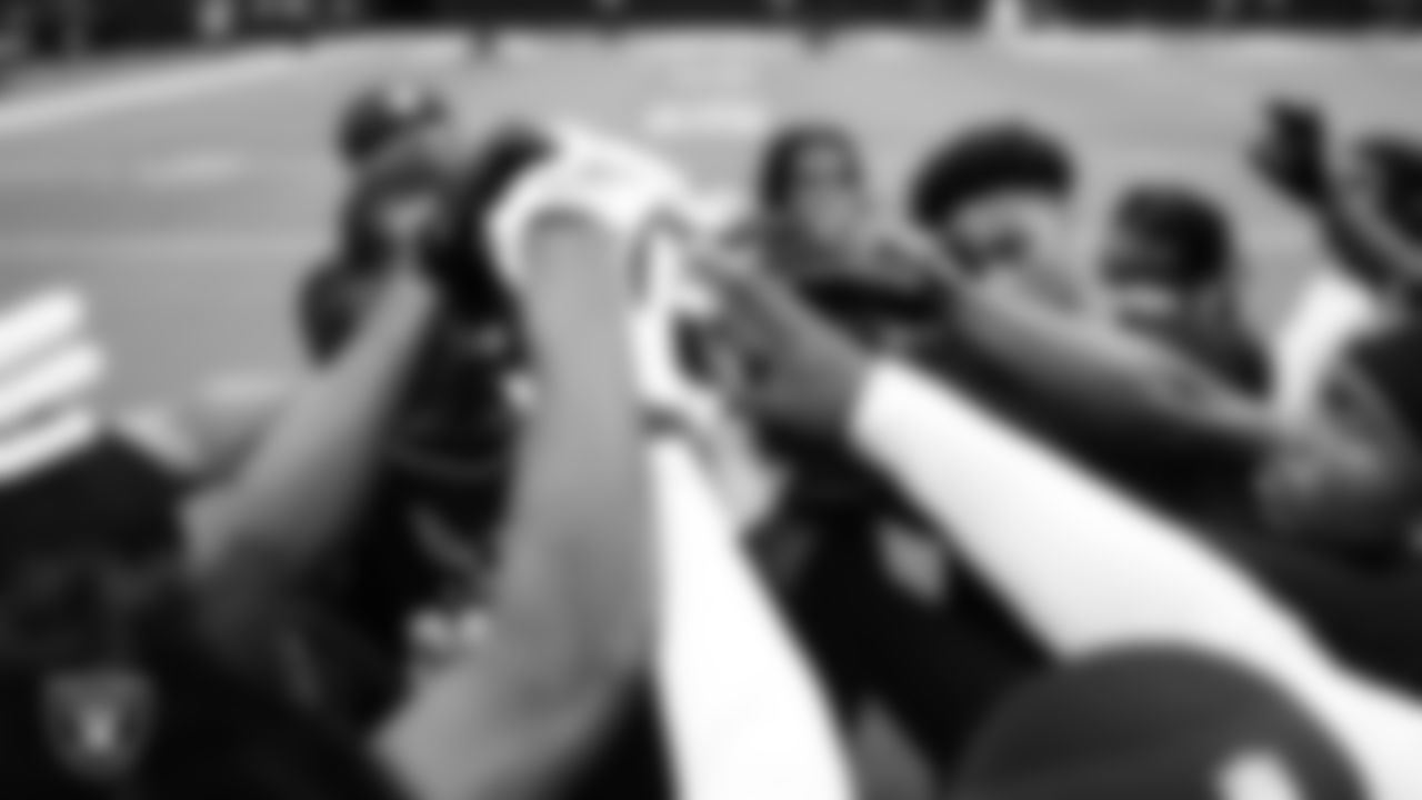 The Las Vegas Raiders defensive backs huddle while warming up before the preseason home game against the San Francisco 49ers at Allegiant Stadium.