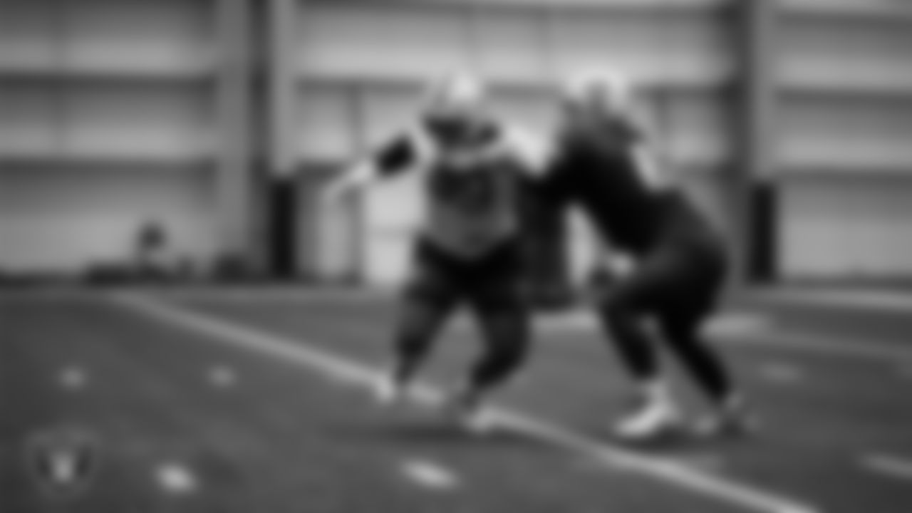 Las Vegas Raiders defensive tackle Thomas Booker IV (99) and center/guard Jordan Meredith (61) during practice at Intermountain Health Performance Center.