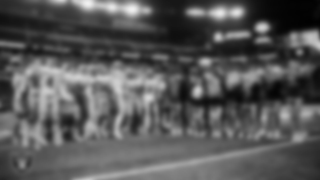 The McQueen High School football and cheer teams celebrate after defeating Pinecrest Academy - Sloan Canyon in the NIAA 4A Division State Championship game at Allegiant Stadium.