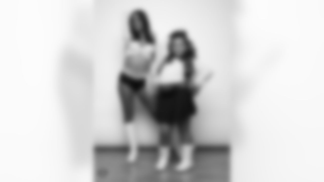Raiderette Reagan poses for a photo with a Junior Raiderette during 2025 Media Day at The Studio.