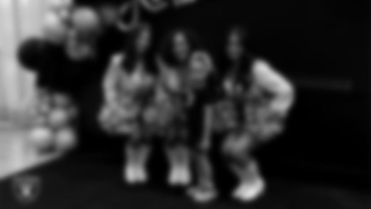 Raiderettes Ashtin, Makenna and Sloane pose for a photo with a dancer during day three of summer camp at The Studio.