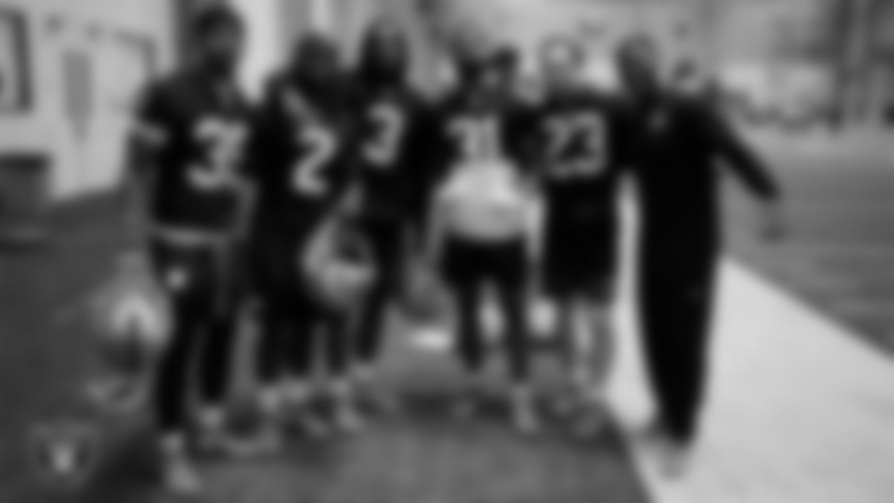 Las Vegas Raiders running back Chris Collier (35), running back Ashton Jeanty (2), running back Zamir White (3), running back Raheem Mostert (31), running back Dylan Laube (23) and running backs coach Deland McCullough during practice at Intermountain Health Performance Center.