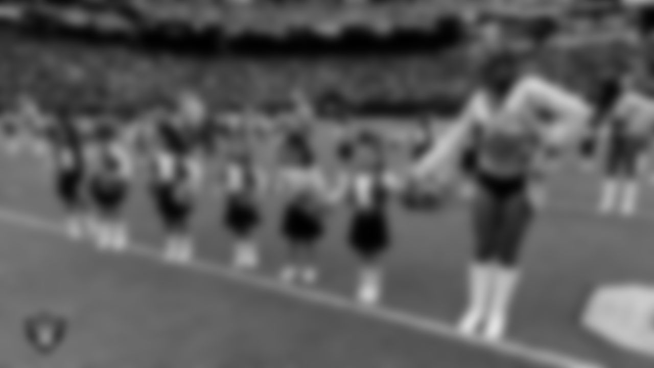 Raiderette Shelby and Junior Raiderettes exit the field after their performance before the preseason home game against the San Francisco 49ers at Allegiant Stadium.
