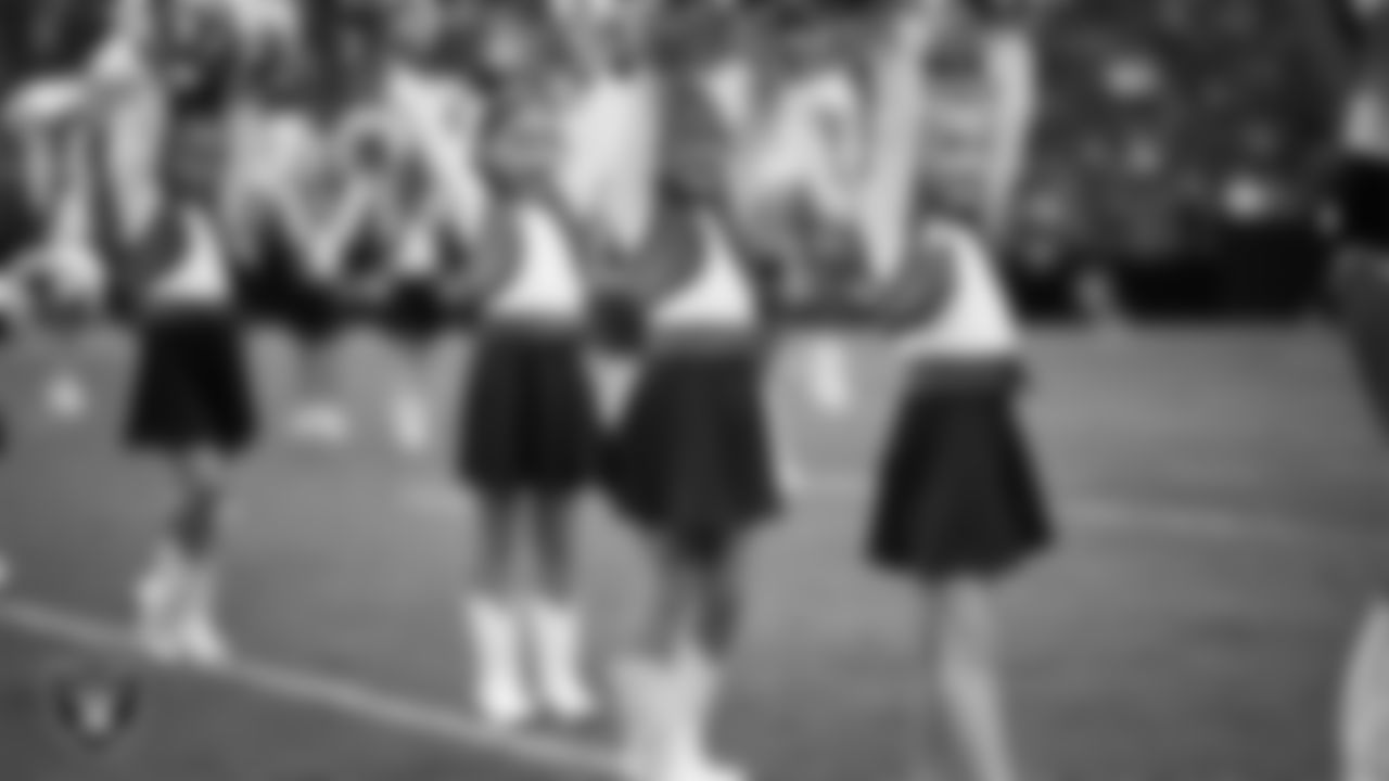 Junior Raiderettes perform on the field before the preseason home game against the San Francisco 49ers at Allegiant Stadium.