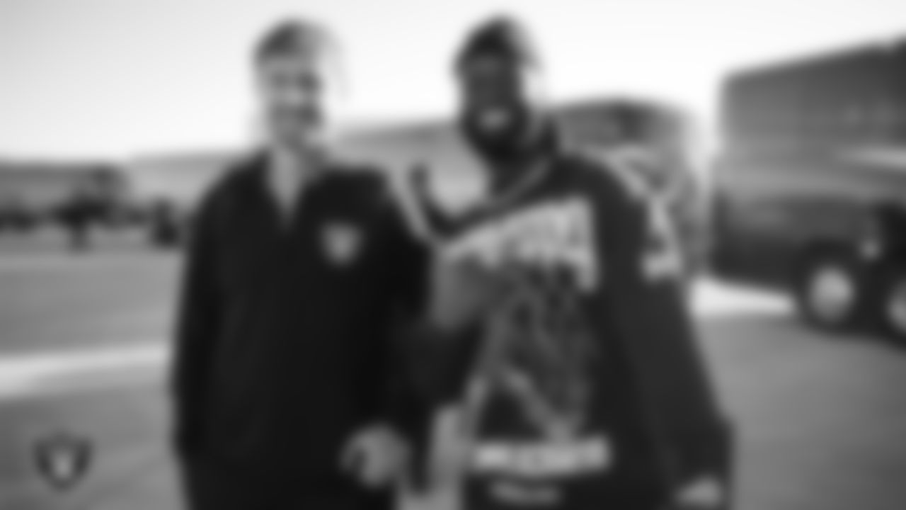 Las Vegas Raiders offensive assistant Sean Binckes and tight end Ian Thomas (80) depart for the regular season away game against the Philadelphia Eagles.