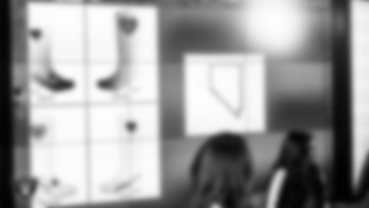 Raiderettes Shayla and Kylee meet with representatives from Hope Means Nevada and designers to design custom boots for the NFL's My Cause My Cleats initiative in Cox Studios at Intermountain Health Performance Center.