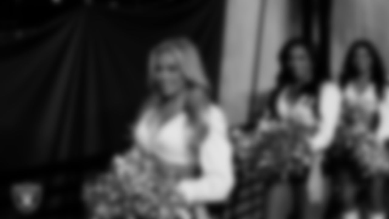 Raiderette Devyn walks through the tunnel before the regular season home game against the Dallas Cowboys at Allegiant Stadium.