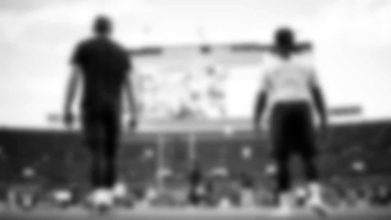 Las Vegas Raiders tight end Brock Bowers (89) and running back Ashton Jeanty (2) warming up before the regular season away game against the Denver Broncos at Empower Field at Mile High.