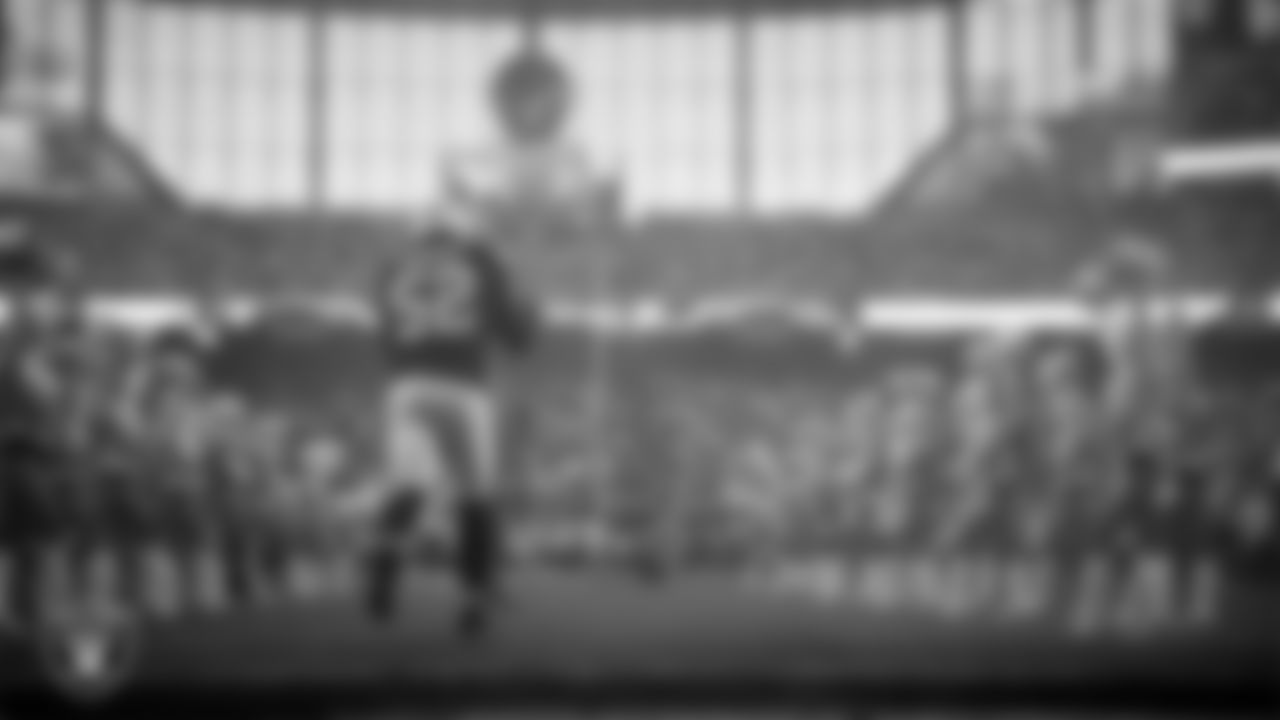 Las Vegas Raiders linebacker Elandon Roberts (52) is introduced onto the field before the regular season home game against the Denver Broncos at Allegiant Stadium.