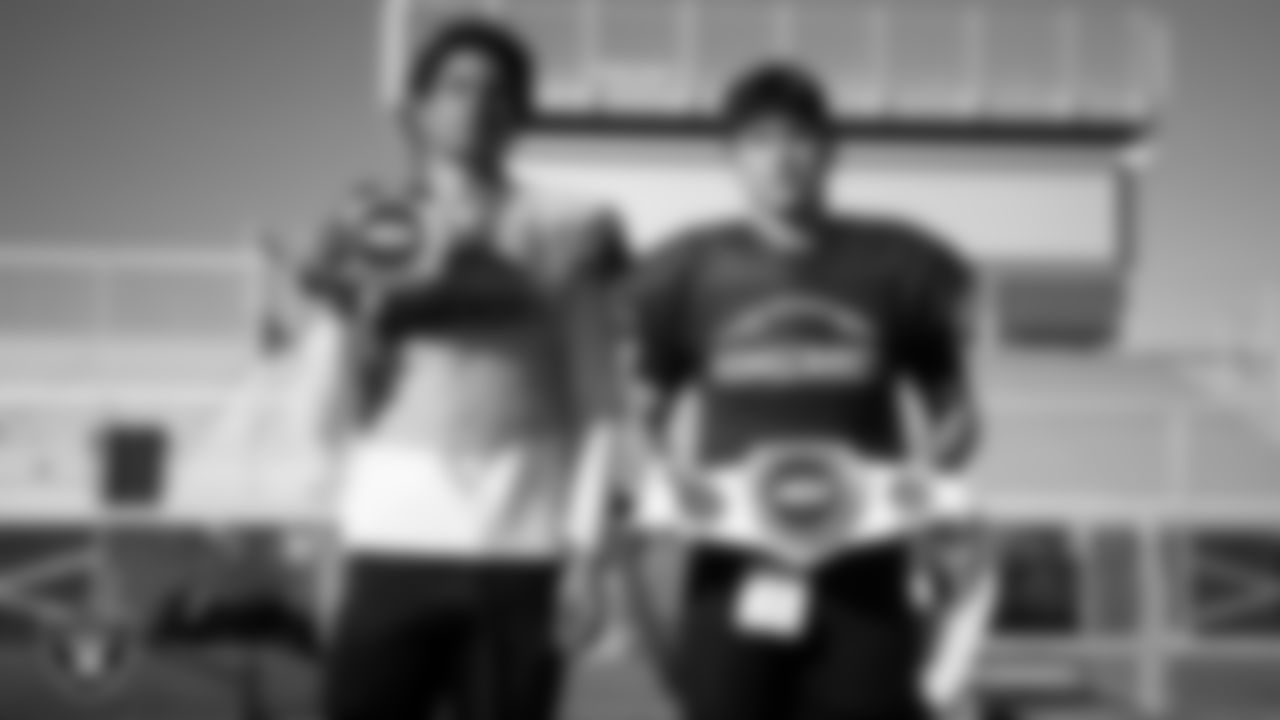 Members of the Somerset Academy Losee football team pose for a photo during practice at Somerset Academy Losee.