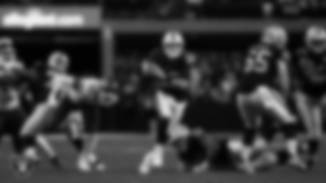 Las Vegas Raiders quarterback Aidan O'Connell (12) runs during the regular season home game against the Kansas City Chiefs at Allegiant Stadium.