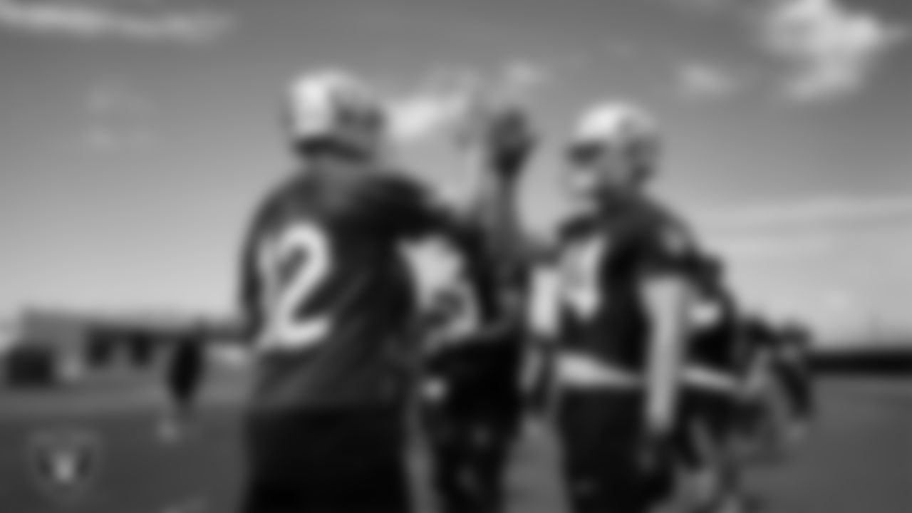 Las Vegas Raiders quarterback Aidan O'Connell (12) and linebacker Tommy Eichenberg (44) at an Organized Team Activity (OTA) at Intermountain Health Performance Center.