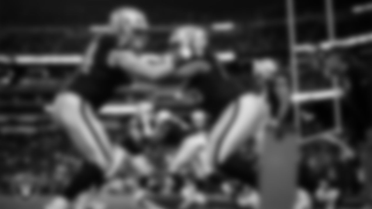 Las Vegas Raiders tackle Kolton Miller (74) and guard Dylan Parham (66) warming up before the regular season home game against the Los Angeles Chargers at Allegiant Stadium.