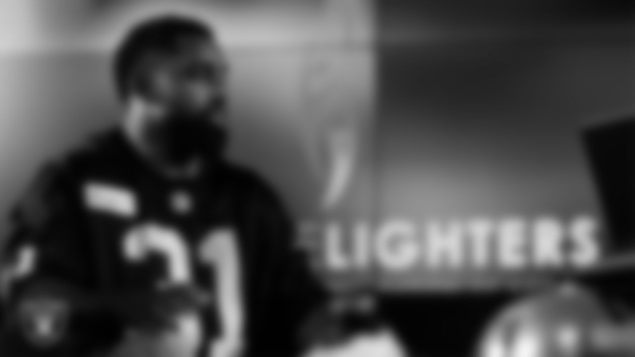 Las Vegas Raiders running back Raheem Mostert (31) works with representatives from Candlelighters Childhood Cancer Foundation and designers to design cleats for My Cause My Cleats in Cox Studios at Intermountain Health Performance Center.