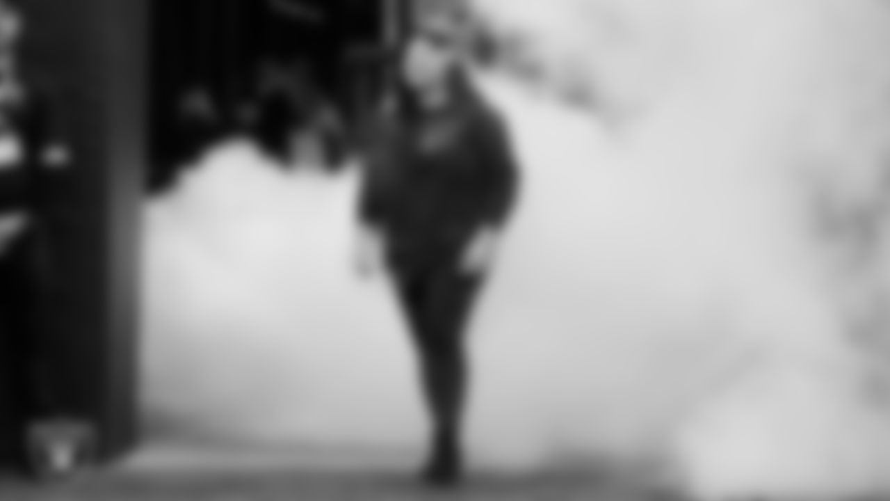 United States Army veteran Sosefina Wongwui is honored during a Salute to Service moment during the regular season home game against the Jacksonville Jaguars at Allegiant Stadium.