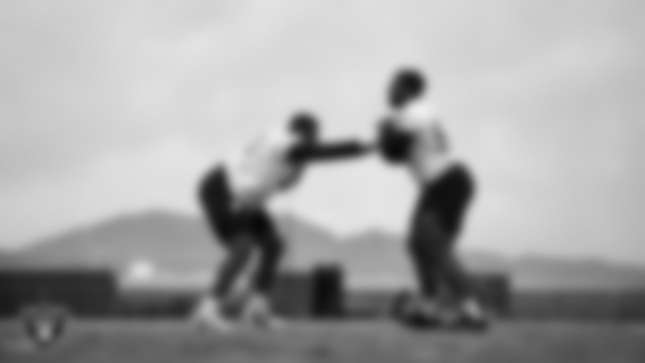 Las Vegas Raiders defensive tackle Brodric Martin (93) and defensive tackle Thomas Booker IV (99) during practice at Intermountain Health Performance Center.