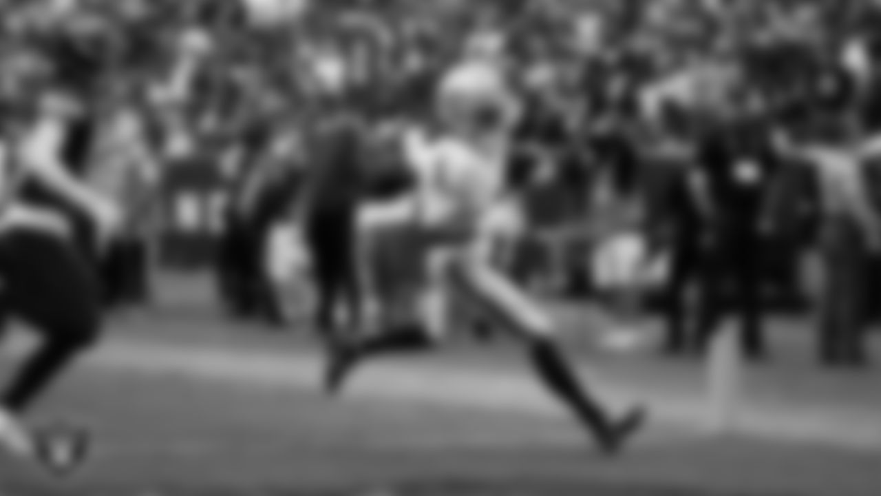 Las Vegas Raiders wide receiver Tre Tucker (1) runs after making a 10-yard touchdown catch during the regular season away game against the Washington Commanders at Northwest Stadium.