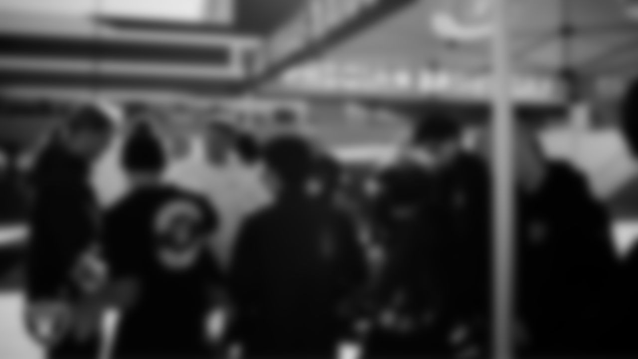 Las Vegas Raiders ambassadors give out equipment to coaches during the Raiders' Equipment Blitz at Intermountain Health Performance Center.