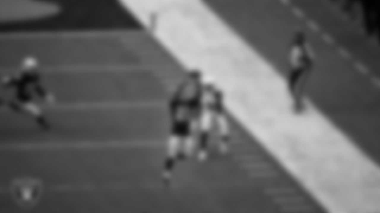 Las Vegas Raiders cornerback Amik Robertson (21) intercepts a pass during the regular season home game against the Arizona Cardinals at Allegiant Stadium, Sunday, September 18, 2022, in Las Vegas, Nev.
