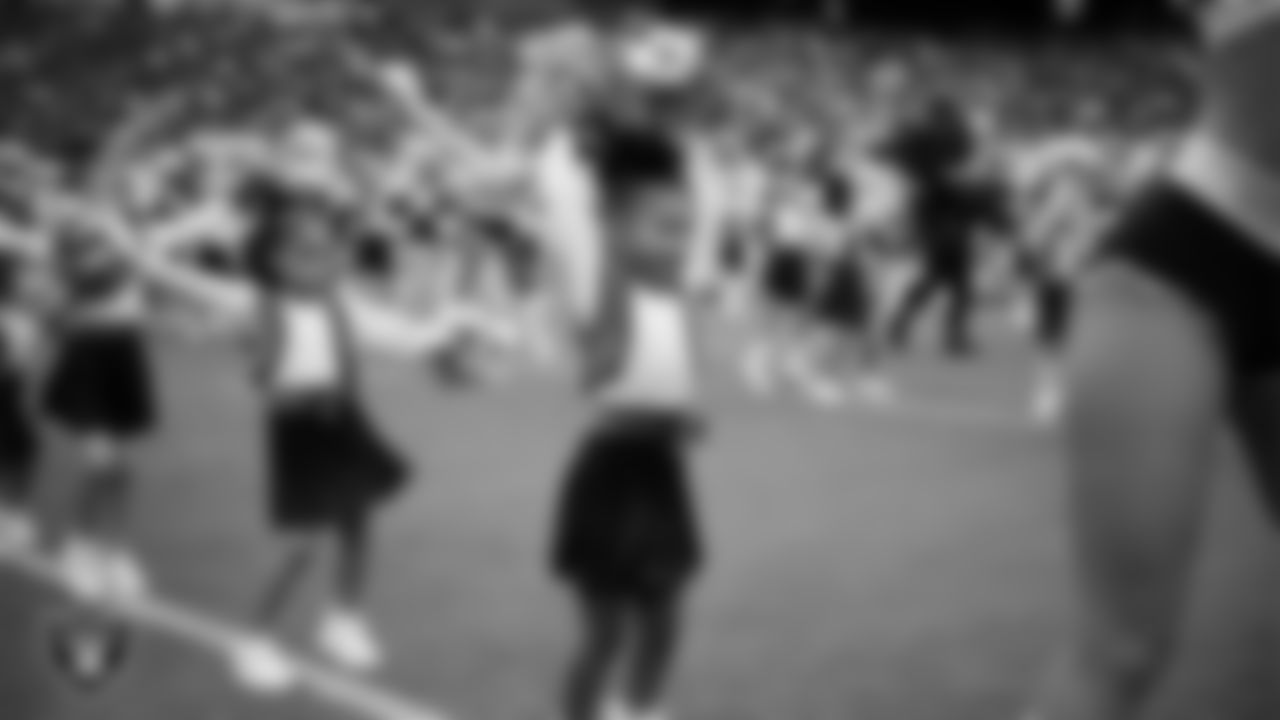 Junior Raiderettes perform on the field before the preseason home game against the San Francisco 49ers at Allegiant Stadium.